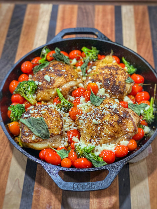 Cast iron seared chicken thighs and tomatoes with feta cheese